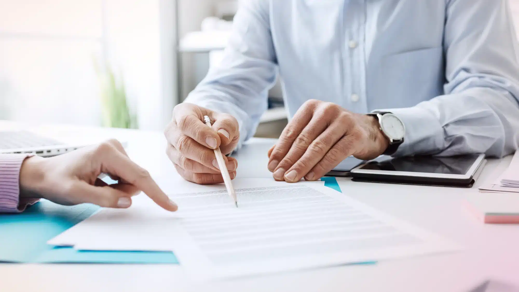 Local Insurance Agent Meeting With A Client To Review Home, Family, And Business Insurance Coverage Options For Comprehensive Financial Protection.